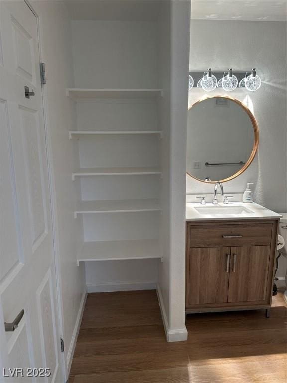 7885 W Flamingo Rd Unit 2129, Las Vegas, NV 89147 - bathroom with wood finished floors and vanity