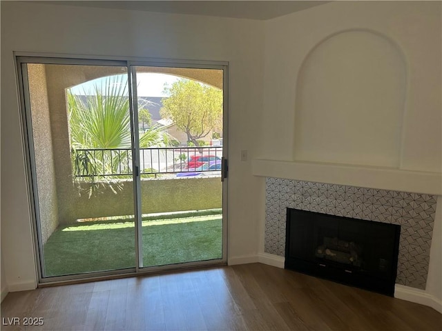 7885 W Flamingo Rd Unit 2129, Las Vegas, NV 89147 - doorway featuring wood finished floors and a tile fireplace