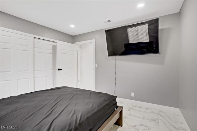 4490 W Warm Springs Rd, Las Vegas, NV 89118 - bedroom with marble look tiles, recessed lighting, and a closet