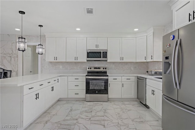 4490 W Warm Springs Rd, Las Vegas, NV 89118 - kitchen featuring stainless steel appliances, a peninsula, light marble finish floors, recessed lighting, and light countertops