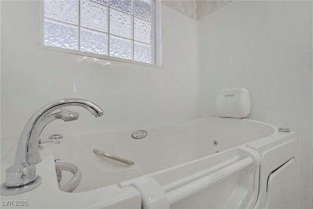 4490 W Warm Springs Rd, Las Vegas, NV 89118 - bathroom featuring plenty of natural light and a tub with jets
