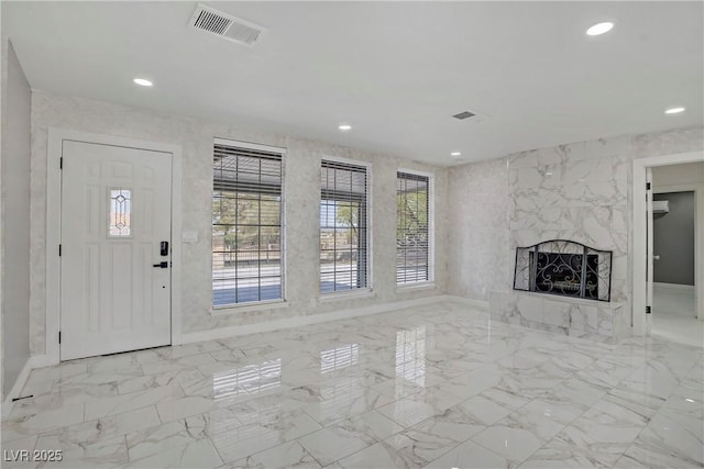 4490 W Warm Springs Rd, Las Vegas, NV 89118 - unfurnished living room featuring marble finish flooring, a premium fireplace, and recessed lighting
