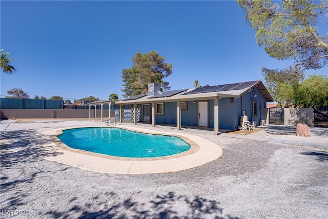 4490 W Warm Springs Rd, Las Vegas, NV 89118 - view of pool with a fenced backyard and a patio