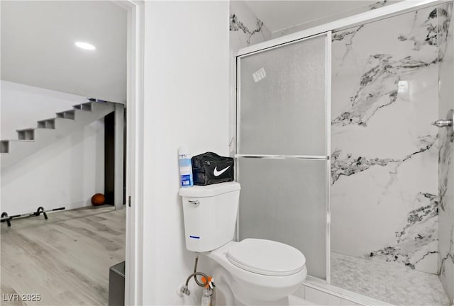 4490 W Warm Springs Rd, Las Vegas, NV 89118 - bathroom with a marble finish shower and wood finished floors