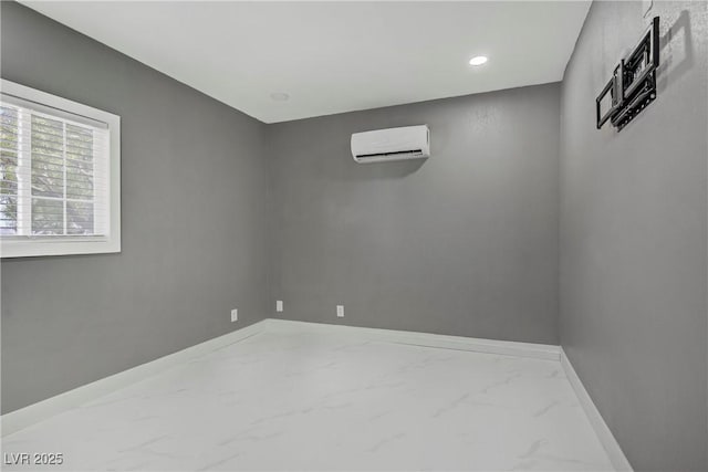 4490 W Warm Springs Rd, Las Vegas, NV 89118 - empty room featuring a wall mounted air conditioner, marble finish floors, and recessed lighting