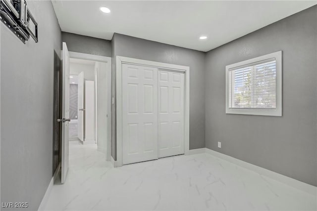 4490 W Warm Springs Rd, Las Vegas, NV 89118 - unfurnished bedroom featuring marble finish floors, a closet, and recessed lighting