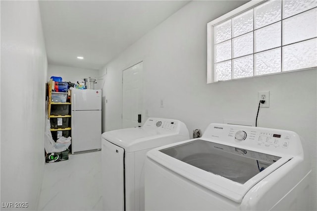 4490 W Warm Springs Rd, Las Vegas, NV 89118 - laundry room with washer and dryer, marble finish floors, and recessed lighting