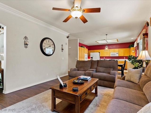 1870 Desert Forest Way, Henderson, NV 89012 - living room with light wood finished floors, ceiling fan, and ornamental molding