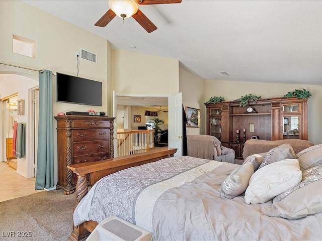 1870 Desert Forest Way, Henderson, NV 89012 - bedroom with lofted ceiling, light colored carpet, a ceiling fan, arched walkways, and light tile patterned floors