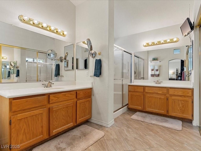 1870 Desert Forest Way, Henderson, NV 89012 - bathroom with a shower stall and two vanities