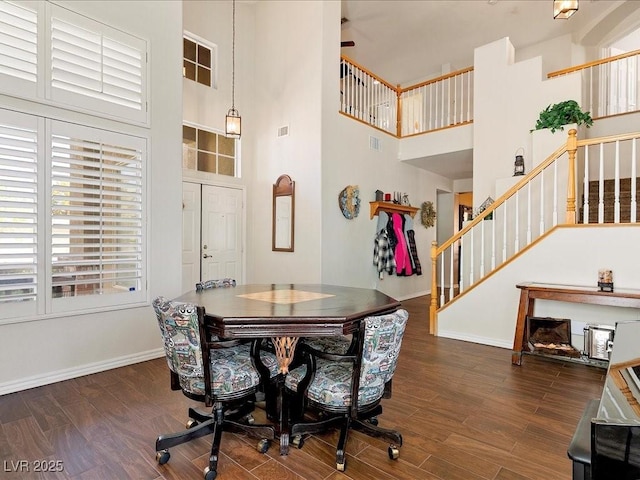 1870 Desert Forest Way, Henderson, NV 89012 - dining room featuring stairway, a high ceiling, and wood finished floors