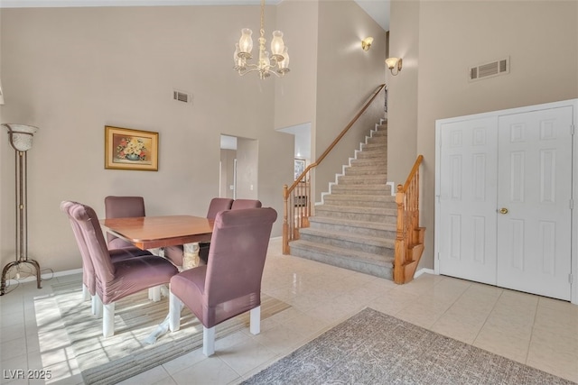 7720 Leavorite Dr, Las Vegas, NV 89128 - dining space with high vaulted ceiling, a chandelier, stairs, and light tile patterned floors