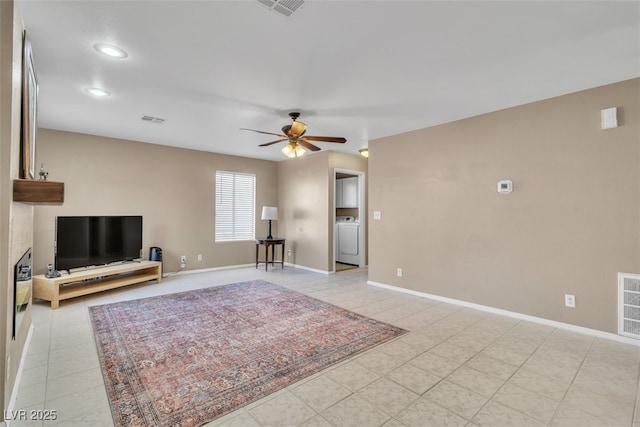 7720 Leavorite Dr, Las Vegas, NV 89128 - living room featuring washer / dryer, ceiling fan, light tile patterned flooring, and recessed lighting