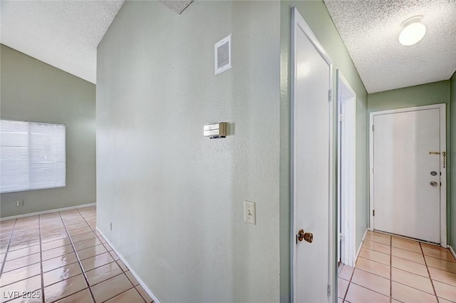 1950 Turtlerock St, Las Vegas, NV 89142 - corridor featuring a textured ceiling and light tile patterned floors