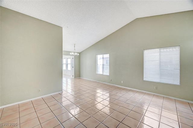 1950 Turtlerock St, Las Vegas, NV 89142 - spare room featuring a chandelier, light tile patterned floors, and high vaulted ceiling