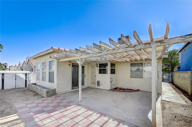 1950 Turtlerock St, Las Vegas, NV 89142 - back of house featuring a pergola, a patio, and stucco siding