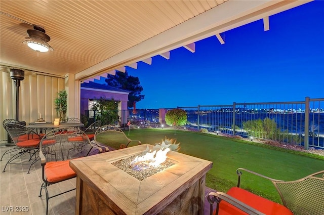 10621 Tinta Ln, Las Vegas, NV 89144 - patio at twilight with an outdoor fire pit