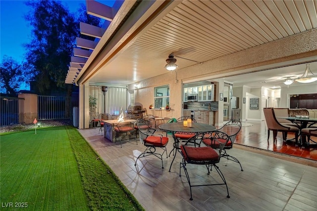 10621 Tinta Ln, Las Vegas, NV 89144 - view of patio / terrace featuring a ceiling fan, a putting green, and outdoor dining space