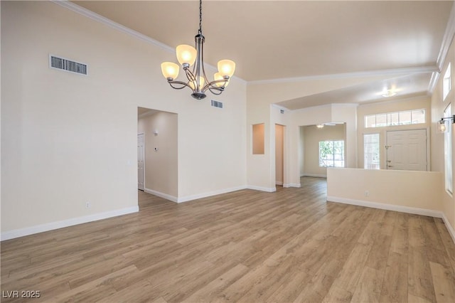 1869 Desert Forest Way, Henderson, NV 89012 - spare room with ornamental molding, a chandelier, and light wood-style flooring