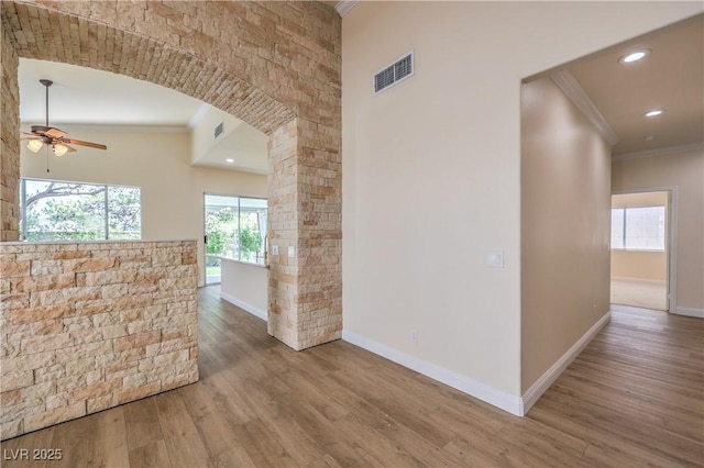 1869 Desert Forest Way, Henderson, NV 89012 - corridor featuring crown molding, wood finished floors, arched walkways, recessed lighting, and decorative columns