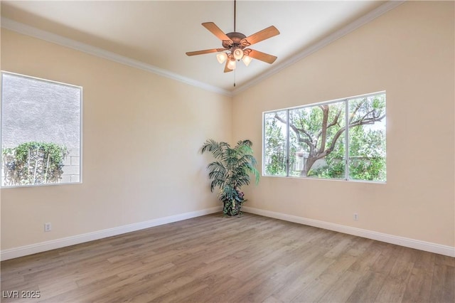 1869 Desert Forest Way, Henderson, NV 89012 - spare room featuring lofted ceiling, wood finished floors, plenty of natural light, a ceiling fan, and crown molding