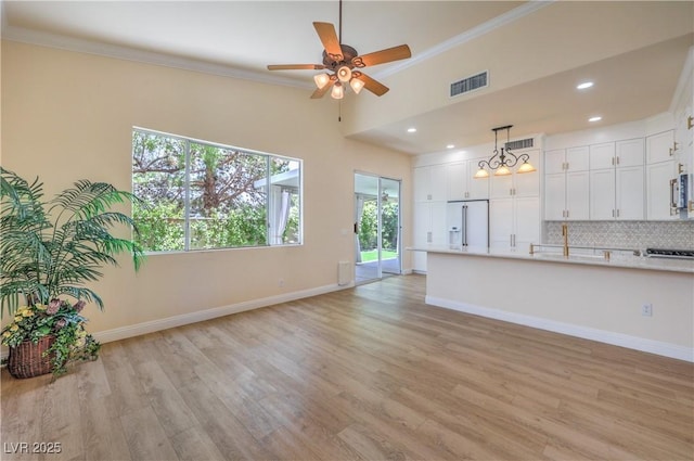 1869 Desert Forest Way, Henderson, NV 89012 - unfurnished living room with ceiling fan, light wood-style floors, ornamental molding, and recessed lighting