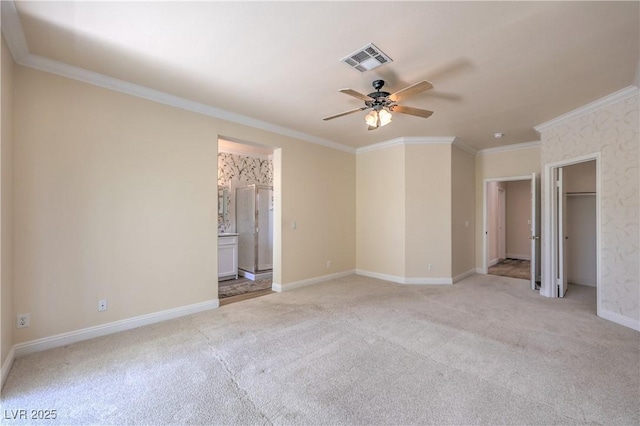 1869 Desert Forest Way, Henderson, NV 89012 - unfurnished bedroom featuring light carpet, ornamental molding, ensuite bathroom, and ceiling fan