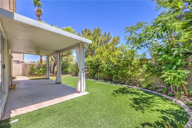 1869 Desert Forest Way, Henderson, NV 89012 - fenced backyard featuring ceiling fan and a patio area