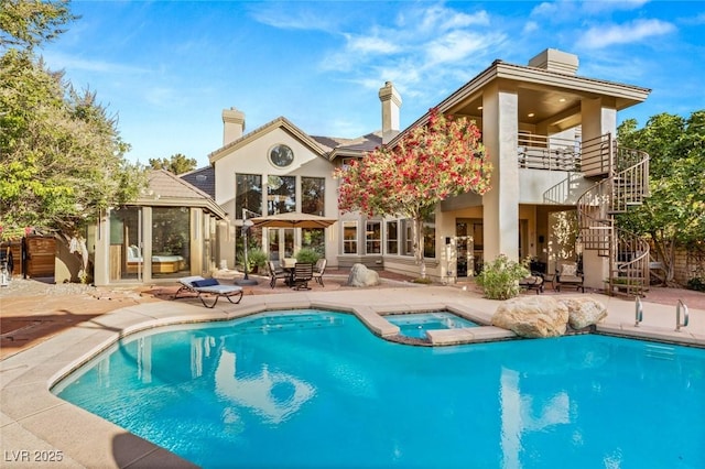 3004 Astoria Pines Cir, Las Vegas, NV 89107 - back of house featuring a chimney, stairs, a patio area, and stucco siding