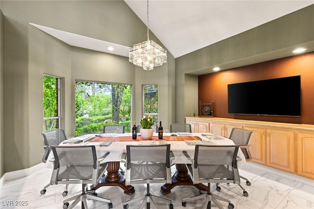 3004 Astoria Pines Cir, Las Vegas, NV 89107 - dining room with high vaulted ceiling, light marble finish flooring, a chandelier, and recessed lighting