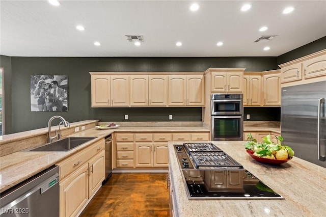 3004 Astoria Pines Cir, Las Vegas, NV 89107 - kitchen featuring light brown cabinets, stainless steel appliances, light stone countertops, and recessed lighting