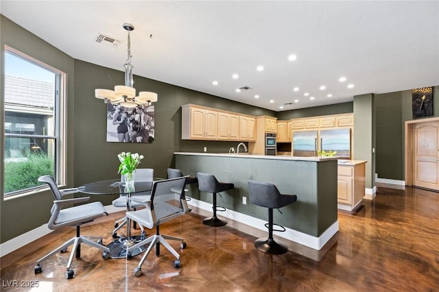 3004 Astoria Pines Cir, Las Vegas, NV 89107 - kitchen with appliances with stainless steel finishes, a peninsula, a chandelier, recessed lighting, and a breakfast bar area