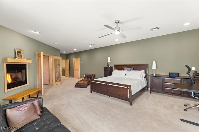 3004 Astoria Pines Cir, Las Vegas, NV 89107 - bedroom with light colored carpet, a glass covered fireplace, recessed lighting, a desk, and ceiling fan