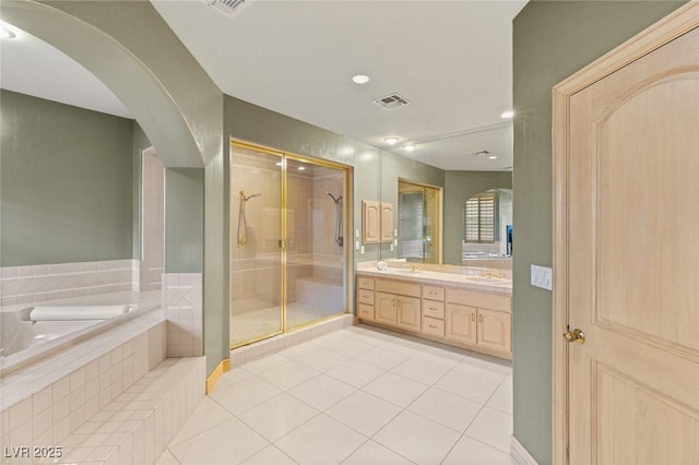 3004 Astoria Pines Cir, Las Vegas, NV 89107 - full bathroom featuring tile patterned flooring, double vanity, a stall shower, and a garden tub