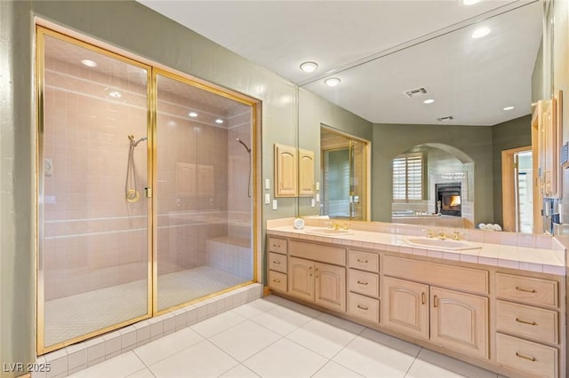3004 Astoria Pines Cir, Las Vegas, NV 89107 - bathroom with double vanity, tile patterned floors, a stall shower, and recessed lighting