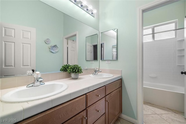 7914 Elk Mountain St, Las Vegas, NV 89113 - bathroom with double vanity and washtub / shower combination