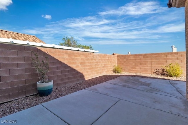 11253 Revelry Ln, Las Vegas, NV 89138 - fenced backyard with a patio
