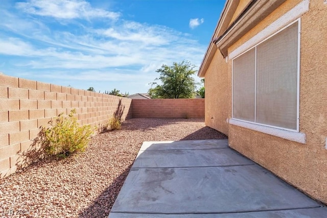 11253 Revelry Ln, Las Vegas, NV 89138 - fenced backyard featuring a patio area