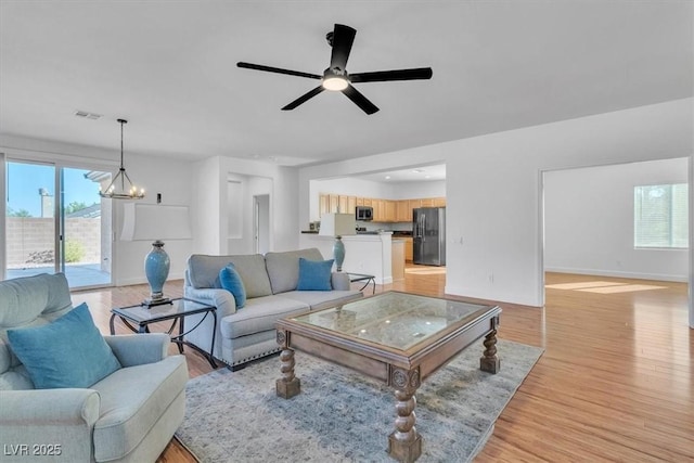 11253 Revelry Ln, Las Vegas, NV 89138 - living room with plenty of natural light, light wood-style flooring, and ceiling fan