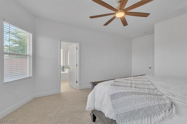 11253 Revelry Ln, Las Vegas, NV 89138 - bedroom with light colored carpet, ceiling fan, and ensuite bathroom