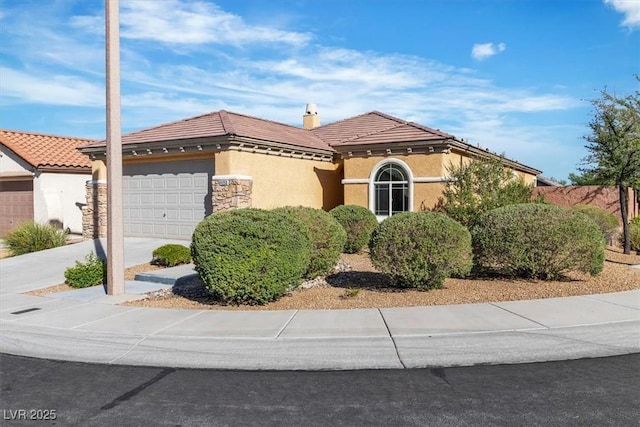 11253 Revelry Ln, Las Vegas, NV 89138 - mediterranean / spanish house with a garage, stucco siding, a tile roof, concrete driveway, and a chimney
