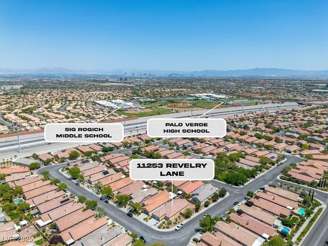 11253 Revelry Ln, Las Vegas, NV 89138 - aerial perspective of suburban area featuring a mountainous background