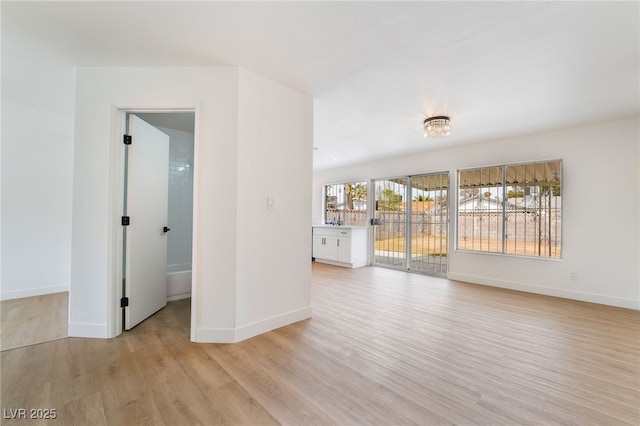 3309 Marionette Ave, Las Vegas, NV 89101 - spare room featuring light wood-style floors and baseboards