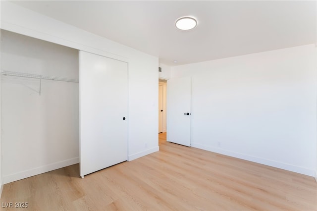 2878 El Cajon St, Las Vegas, NV 89169 - unfurnished bedroom featuring light wood-type flooring and a closet
