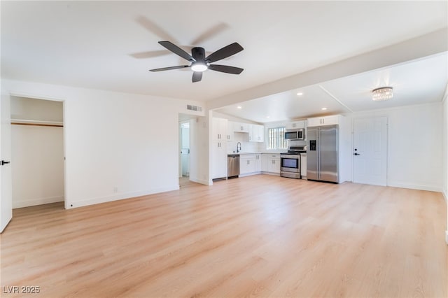 2878 El Cajon St, Las Vegas, NV 89169 - unfurnished living room featuring a ceiling fan, light wood-style floors, and recessed lighting