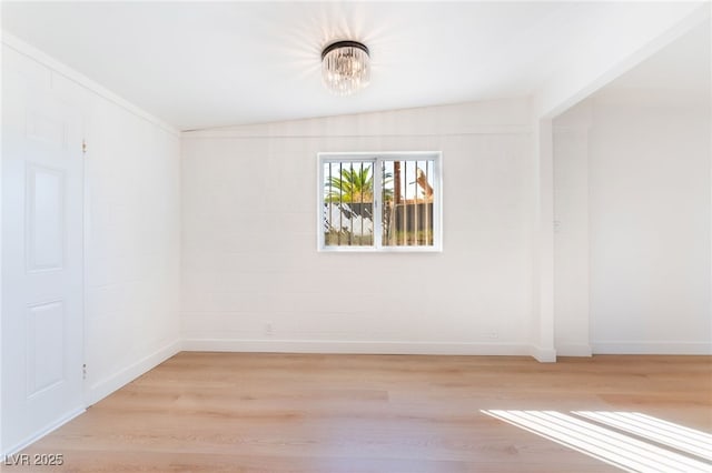 2878 El Cajon St, Las Vegas, NV 89169 - spare room featuring light wood-style flooring and a chandelier