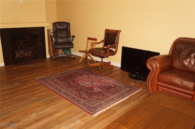 2851 S Valley View Blvd Unit 1134, Las Vegas, NV 89102 - sitting room featuring wood finished floors and a fireplace