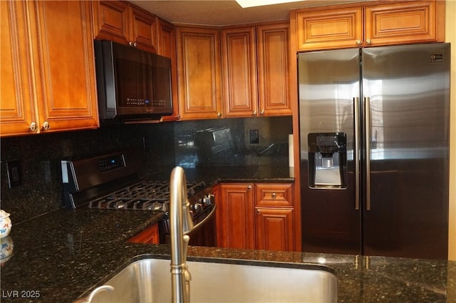 2851 S Valley View Blvd Unit 1134, Las Vegas, NV 89102 - kitchen featuring stainless steel refrigerator with ice dispenser, black microwave, backsplash, and dark stone counters
