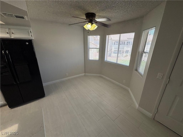 435 Mesa Blvd Unit 202, Mesquite, NV 89027 - unfurnished dining area featuring plenty of natural light, a textured ceiling, and a ceiling fan