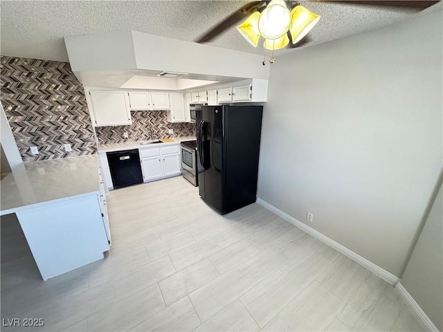 435 Mesa Blvd Unit 202, Mesquite, NV 89027 - kitchen featuring black appliances, ceiling fan, white cabinetry, light countertops, and a textured ceiling